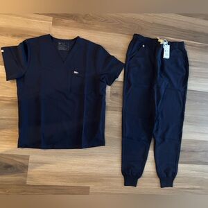 Men’s navy Figs scrubs new with tags. L top, M jogger bottom.